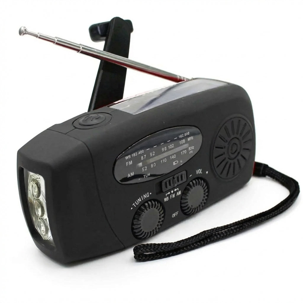 Svart nödradio med analog mottagare, högtalare, bandväljare och rattar på framsidan